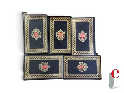 four black and gold book cases with roses on them