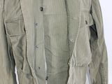 an image of a green jacket on a mannequin mannequin stand