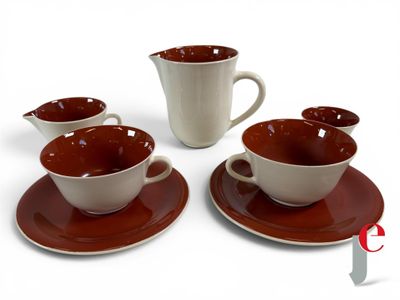 four cups and saucers sitting on a saucer
