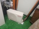 a small air conditioner in the corner of a room