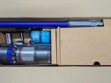 a box with a vacuum and other items inside of it