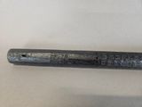 an old baseball bat that is laying on a table