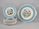 several blue and white plates with a picture of a man and a woman on them