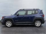 the blue jeep is parked in the parking lot near the water