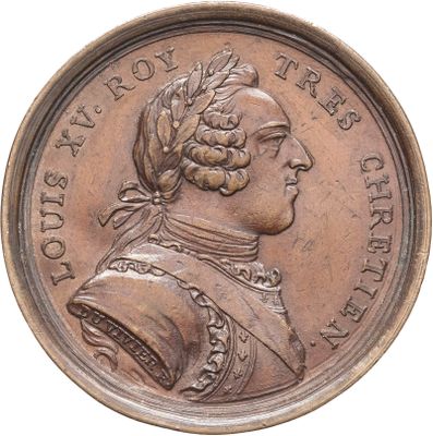 une vieille pièce de monnaie sur laquelle figure le buste d'un homme coiffé d'un turban