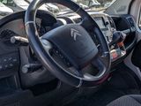 a view of the inside of a vehicle with the steering wheel