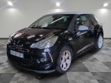 a picture of a small black car parked in a garage