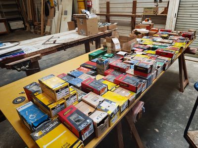 a lot of boxes on a table in a warehouse