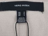 a close up of a label on the back of a sweater