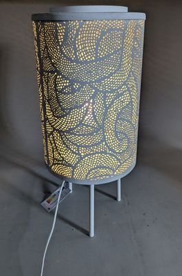 a close up of a lamp on a stand with a cord