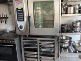 a kitchen with a lot of pots and pans on the counter