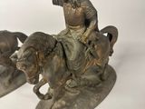 statue of a man on a horse with a man on a horse