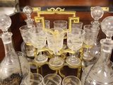 many glasses and decanters sitting on a table