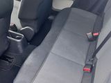 two seats in the back of a white car