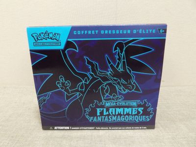 a box of pokemon figurines with a dragon on it