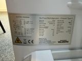 a close up of a refrigerator with a label on it