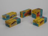 four boxes of match - up cars are lined up on a white surface