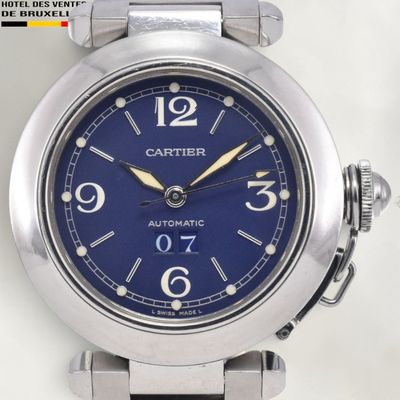 a close up of a wrist watch with a blue face