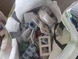 two bags full of assorted items sitting on the floor