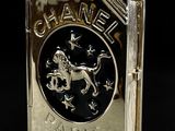 chanel gold plated book charm with a horse and carriage