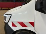 a white van with a red stripe on the side of it