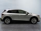 the silver suv is parked on the concrete floor in the room