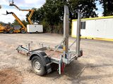 an image of a trailer with a crane in the background