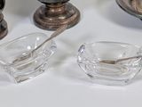 a small glass bowl and a small glass bowl with a spoon in it