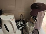a coffee maker and a blender sitting on a kitchen counter