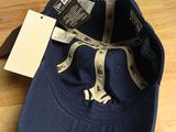 baseball cap with new york yankees logo on it sitting on a wooden table