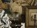 the cover of a book with a picture of a statue and other items