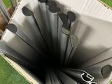 a cardboard box with a bunch of umbrellas inside of it