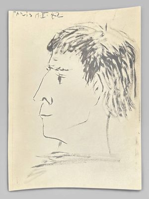 un dessin du visage d'un homme sur une feuille de papier