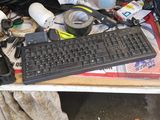 a computer desk with a keyboard and a monitor on it
