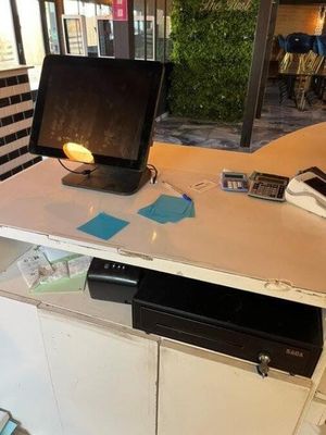 a desk with a monitor and a keyboard on top of it