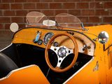 an orange car with a wooden steering and a steering wheel