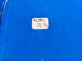 a small sticker on the side of a blue box