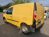 a yellow van that is parked in a parking lot