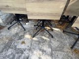 four chairs and a table on the concrete floor