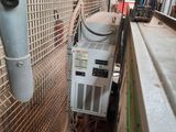 a small air conditioner in the corner of a room