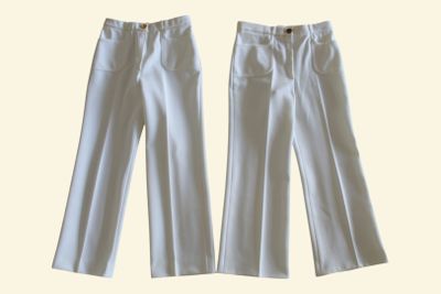 pair of white pants with buttons on the side of them