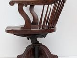 an image of a wooden chair with a wooden seat on a white surface