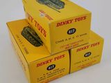three boxes of dirty toys are stacked on top of each other