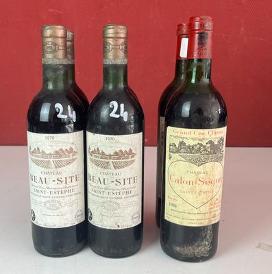trois bouteilles de vin sont alignées sur un comptoir