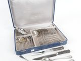 a blue case with silverware in it on a white surface