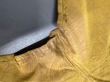 a close up of a pair of yellow pants on a table