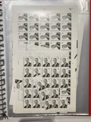 a lot of stamps on the pages of a binder