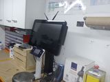 an image of a kitchen with a tv and a counter top