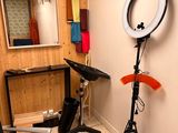 a photo of a room with a chair and a mirror