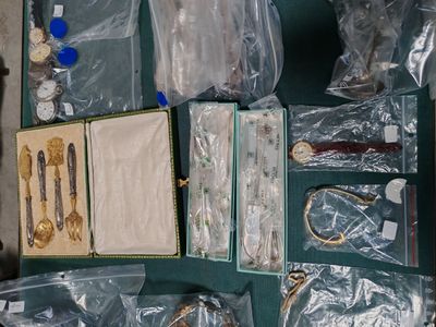a suitcase full of items that are sitting on the floor